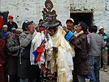 Mustang Lo Manthang Tiji Festival Day 3 10 Dorje Jono With Katas To Celebrate The Killing Of His Demon Father After killing his demon father, Dorje Jono and the monks and walk back into the main square in Lo Manthang, where the local people put katas around his neck, probably three or four hundred of them. Quite a sight.